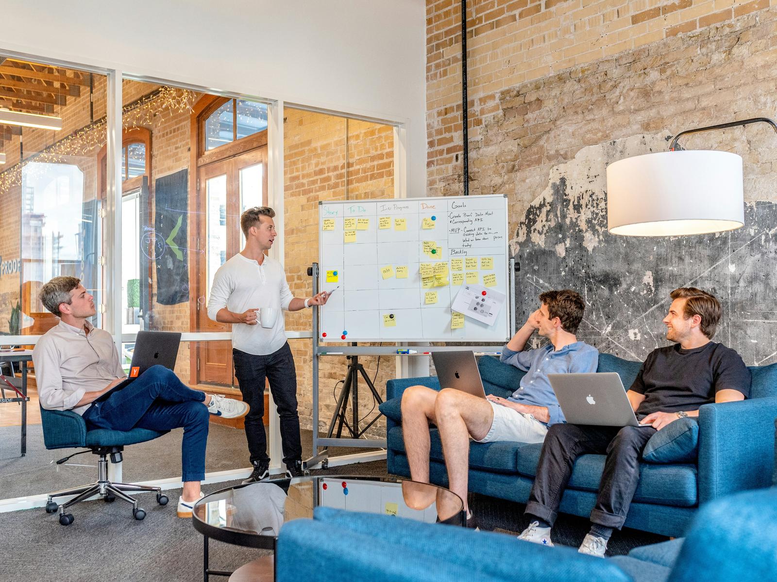 Team reviewing a strategy board in a modern office