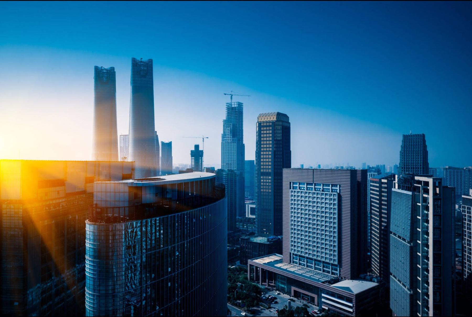 Glass office towers against a clear sky